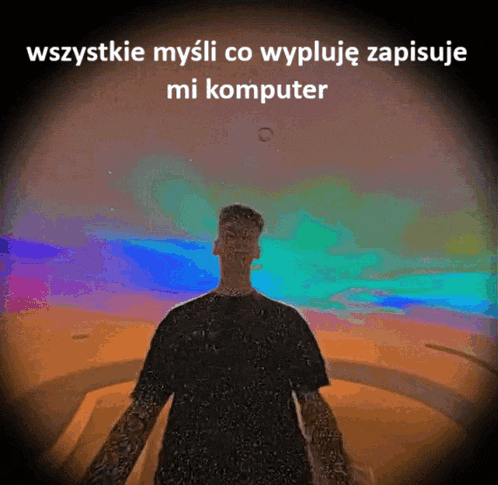 a man in a black shirt is standing in front of a colorful background with the words wszystko mysli co wypluje zapisuje mi komputer