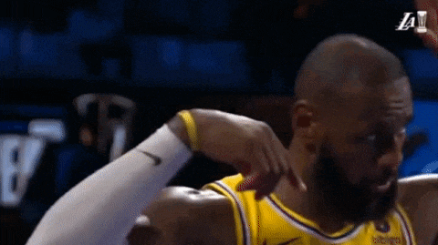 a close up of a basketball player 's arm with a yellow wristband .