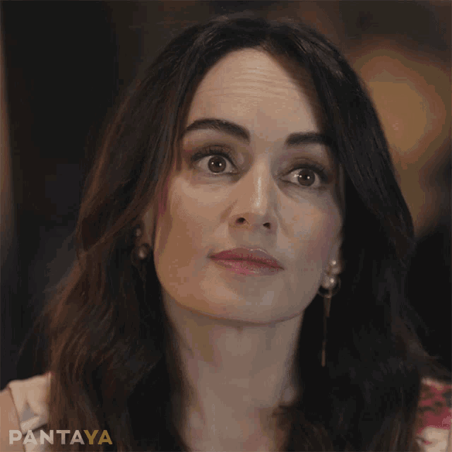 a close up of a woman 's face with the word pantaya on the bottom right