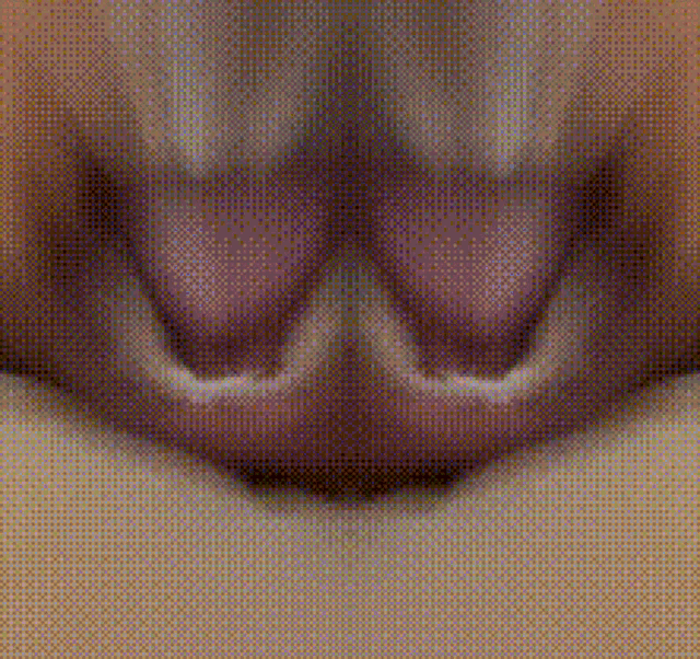 a close up of a person 's lips with a pixelated pattern .