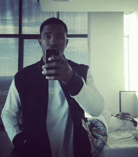 a man is taking a picture of himself with his cell phone