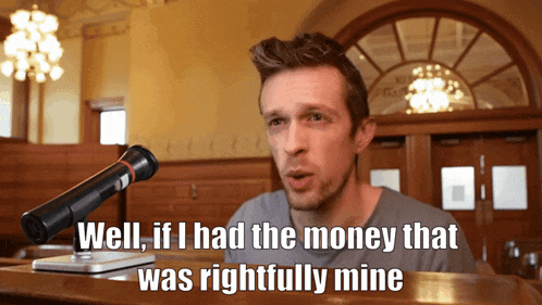 a man talking into a microphone with the words well if i had the money that was rightfully mine