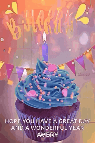 a birthday cupcake with blue frosting and a candle