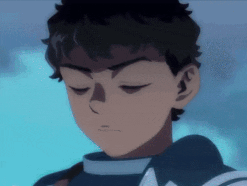 a close up of a boy with his eyes closed