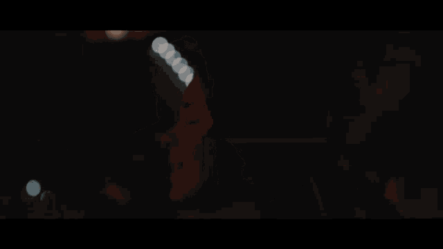 a stage with a lot of lights and a person on it