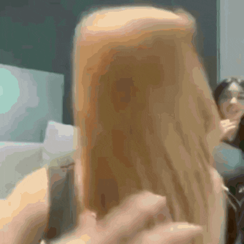 a blurry picture of a person holding a phone
