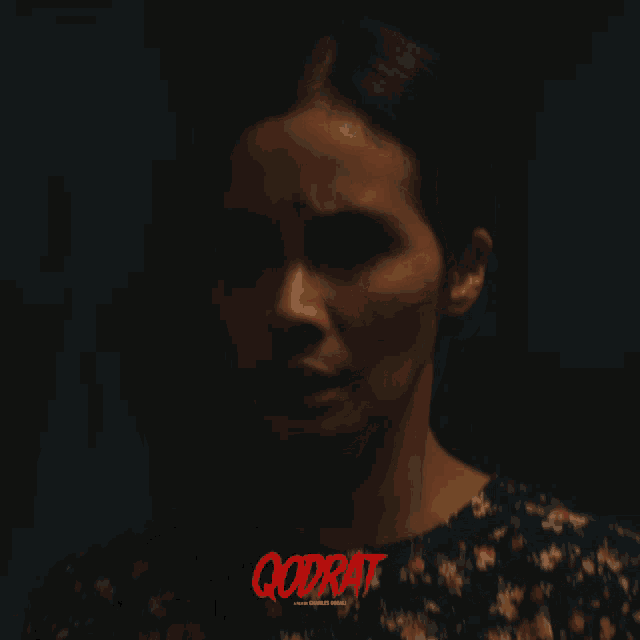 a movie poster for godrat features a woman in a floral top