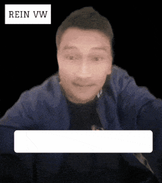 a man in a blue jacket is looking at the camera with rein vw written above him