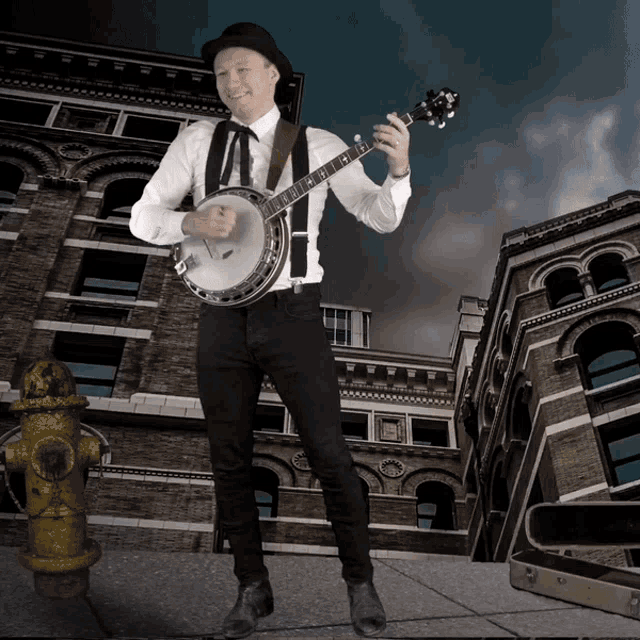 a man is playing a banjo in front of a brick building