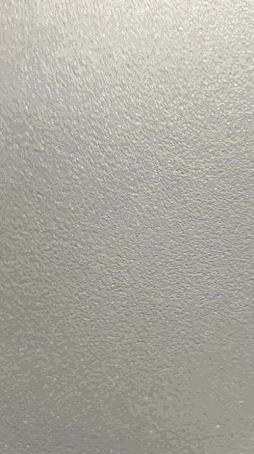a blurry picture of a ceiling with a light on