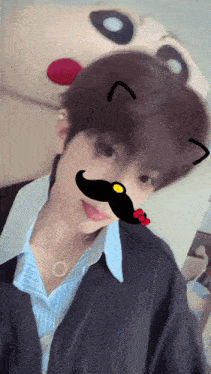 a young man with a fake mustache and cat ears
