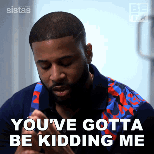 a man says " you 've gotta be kidding me " while wearing a blue and red shirt