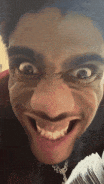 a close up of a man making a funny face with money in the background
