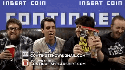 a group of men are sitting on a couch holding a book called who killed lana
