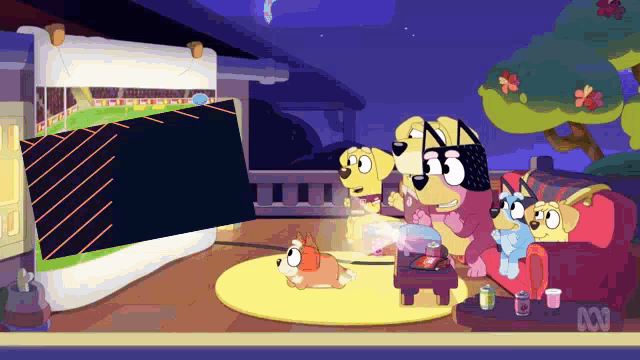 a group of cartoon dogs are watching a game on a large screen .