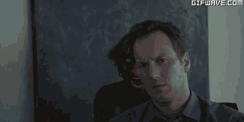 a cartoon character with a surprised look on his face stands next to a man