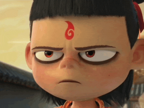 a cartoon character with a red flame on his forehead .
