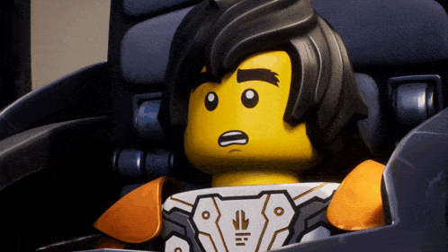 a close up of a lego character with a surprised expression on his face