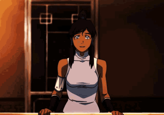 a woman in a white top is standing in front of a door with the letters sas on the bottom