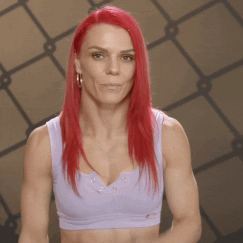a woman with red hair is wearing a purple bra