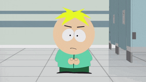 a cartoon character from south park is standing in a bathroom