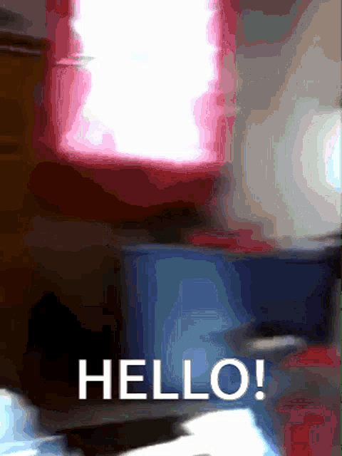 a blurred image of a room with the words hello in white letters