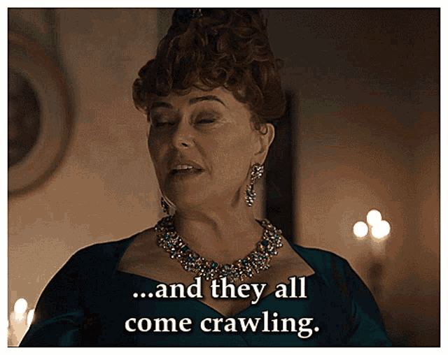 a woman says " and they all come crawling " while wearing a necklace