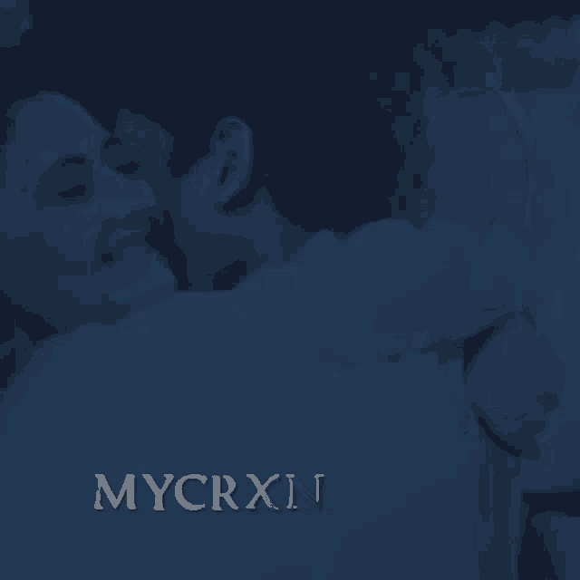 a dark blue background with the word mycrxn in gold letters