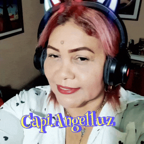 a woman with pink hair is wearing headphones and the name angelluz is on the bottom