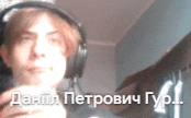 a man wearing headphones is holding a cup in his hand