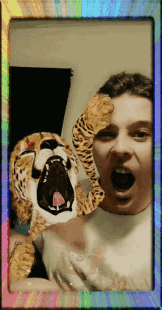 a picture of a man and a stuffed animal with a rainbow frame around it