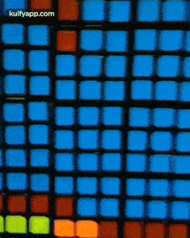 a close up of a colorful rubik 's cube with the words kulfyapp.com on the bottom .
