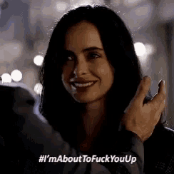 a woman is smiling while being touched by a man and the caption says i 'm about to fuck you up