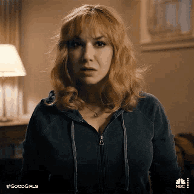 a woman in a blue hoodie with the hashtag #goodgirls on the bottom right