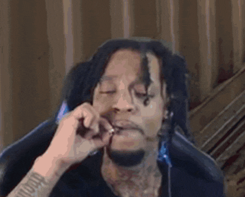 a blurry picture of a man talking on a cell phone