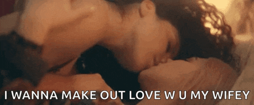 a man and woman are kissing on a bed with the words `` i wanna make out love w u my wifey ''