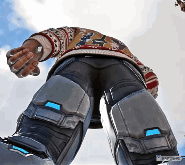 a man wearing a sweater and pants is looking up at something