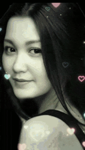 a close up of a woman 's face with hearts around her
