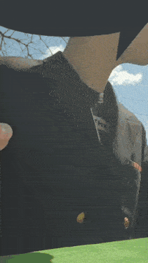 a man in a black suit has a name tag that says " the " on it