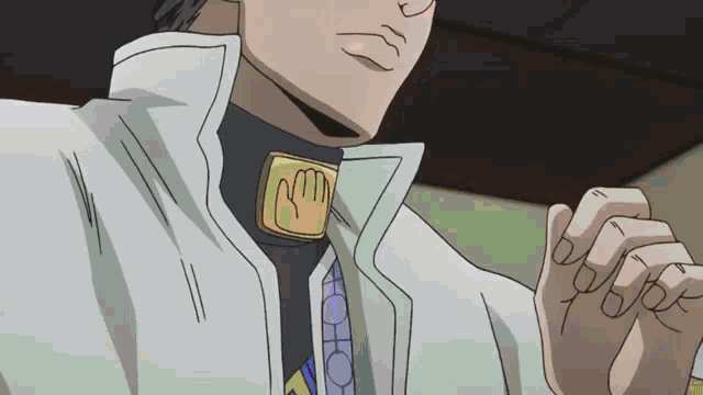 a close up of a man 's neck with a necklace that says ' nm ' on it