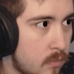 a close up of a man wearing headphones and making a face .