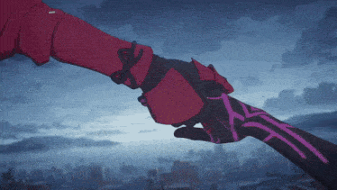 a person in a red jacket is holding another person 's hand with a city in the background