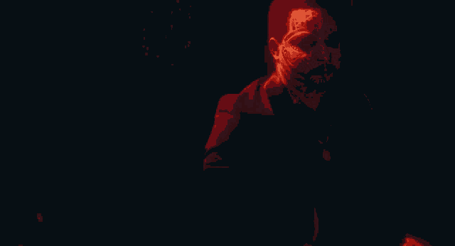 a person with a mask on their face is holding a red light