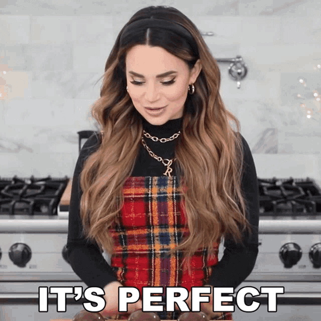 a woman standing in front of a stove with the words " it 's perfect " on the bottom
