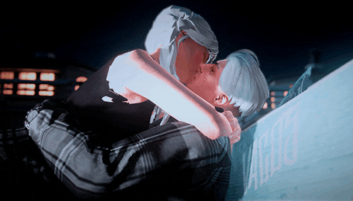 a couple kissing in front of a sign that says ' a '