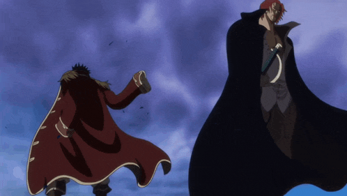 a man in a red cape and a man in a black cape are standing next to each other
