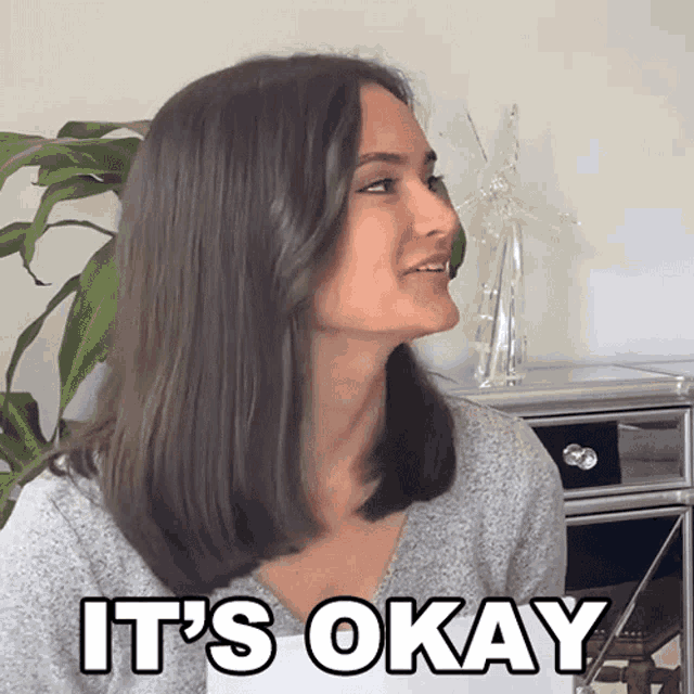 a woman says " it 's okay " in a room