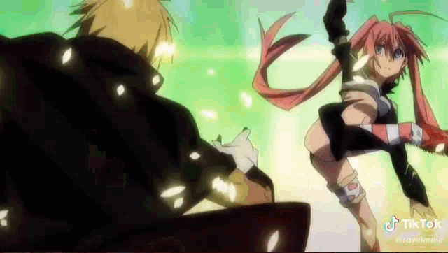 a man and a woman are standing next to each other in a fight .