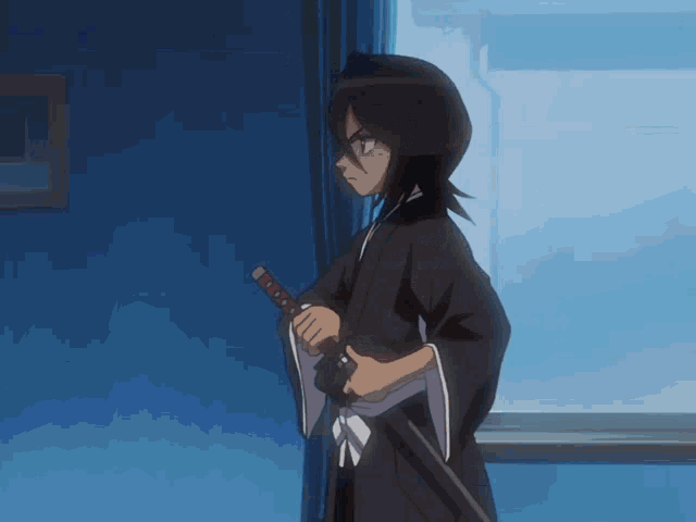 a person in a kimono holding a sword in front of a window