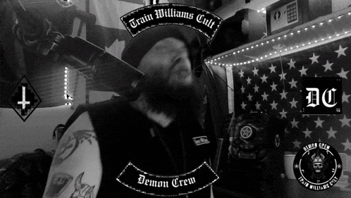 a black and white photo of a man with demon crew written on the bottom